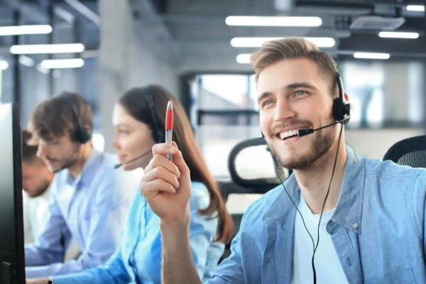 Smiling agent providing professional cold calling services.