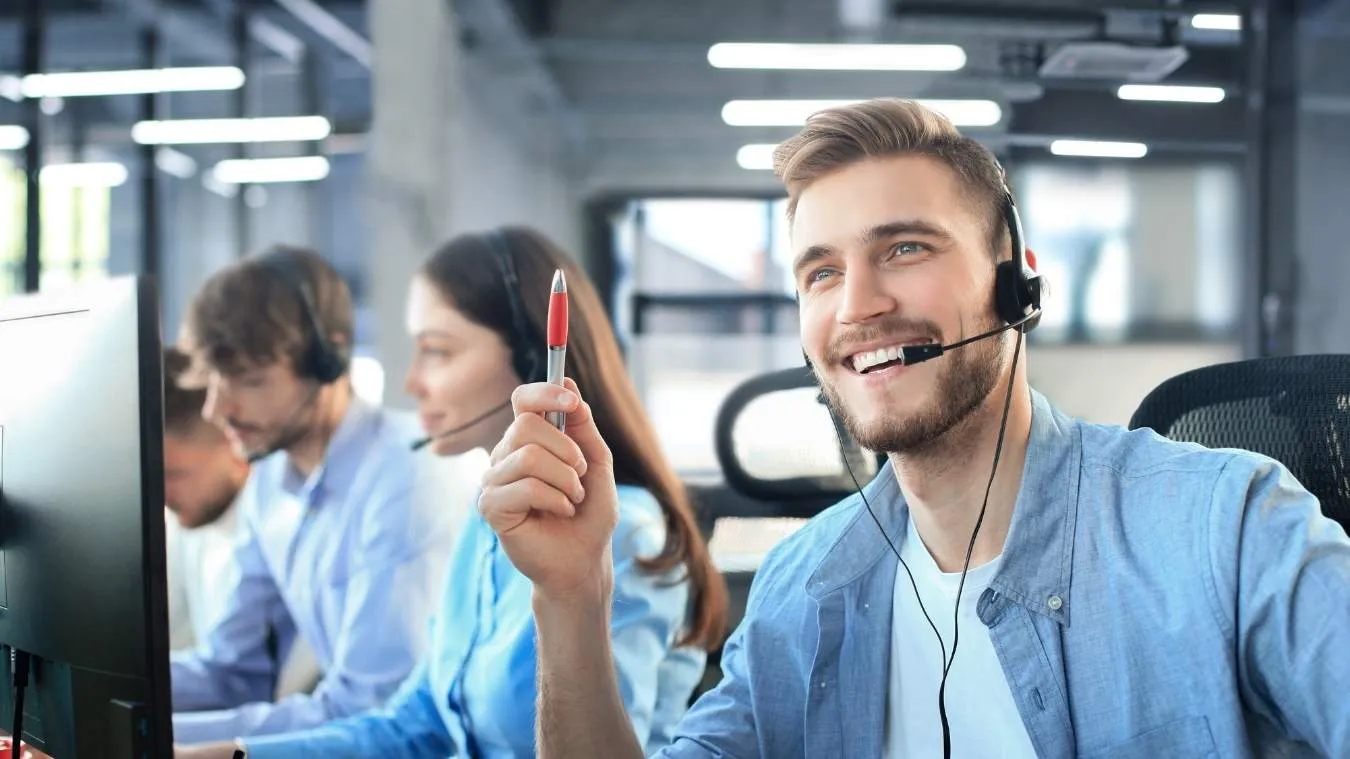 Smiling agent providing professional cold calling services.